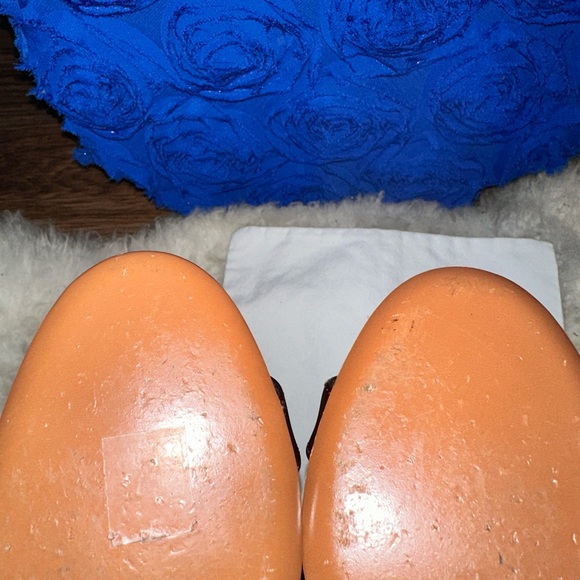 - [ ] Burgundy leather Chloé round-toe pumps with brass hardware, stacked heel - Picture 5 of 8